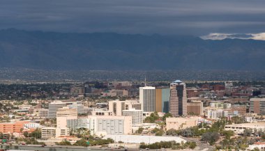 Downtown Tucson in Arizona with storm clouds clipart
