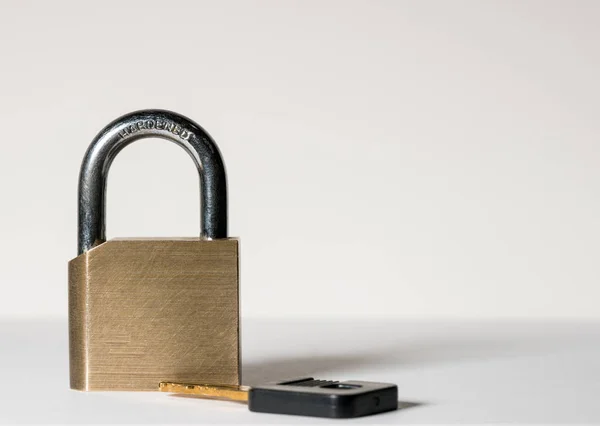 Macro shot of isolated brass padlock — Stock Photo, Image