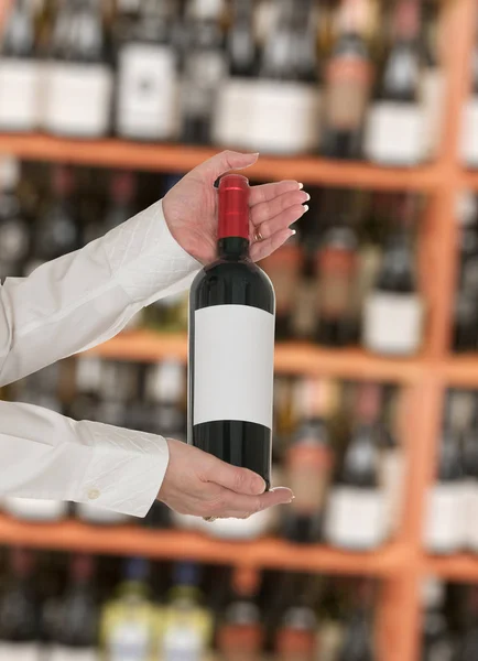 Sommelier offering bottle of red wine to customer — Stock Photo, Image