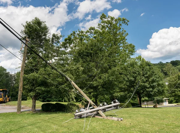 Snapped and downed power post and line after storm — Stock Photo, Image