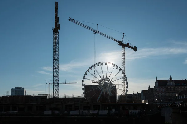 Cranes erecting new apartments near old town Gdansk — Stock Photo, Image