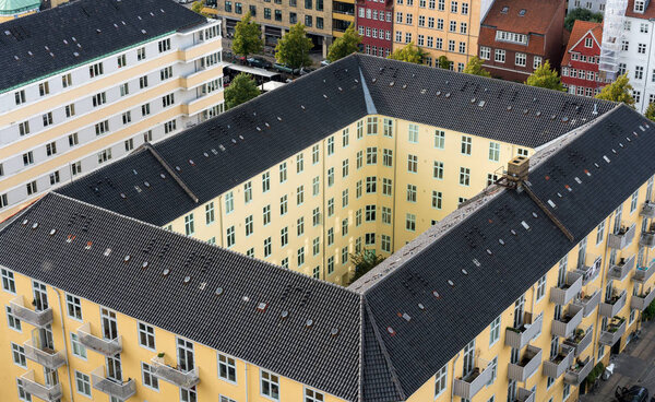 Overhead view of apartment building in Copenhagen in Denmark from top of church tower