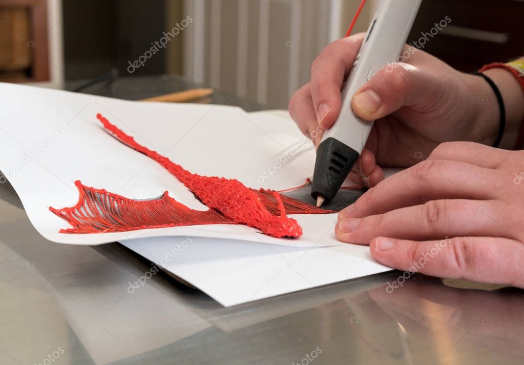 3-D printing pen creating a dragon shape