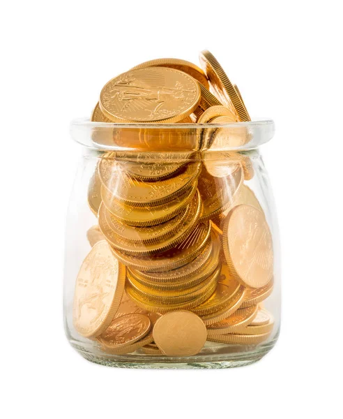 Guldmynt inuti glasburk att representera besparingar eller investeringar — Stockfoto