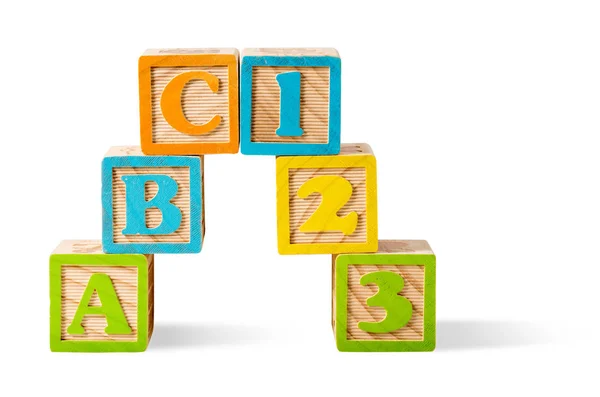 Letter and number blocks stacked on white background — Stock Photo, Image