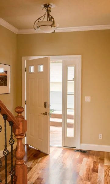 Front door and hall with wooden floor — Stock Photo, Image