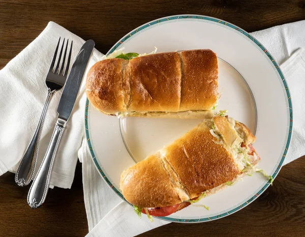 Flat lay of crusty BLT sandwich take out food arranged on plate — Stock Photo, Image