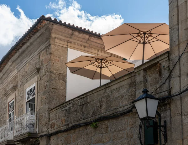Rooftop restaurant on stone houses in Guimaraes in Portugal