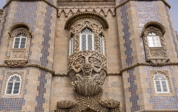 Pena Palace outside Sintra with the carving of the Arch of Triton over the entrance — Stock Photo, Image