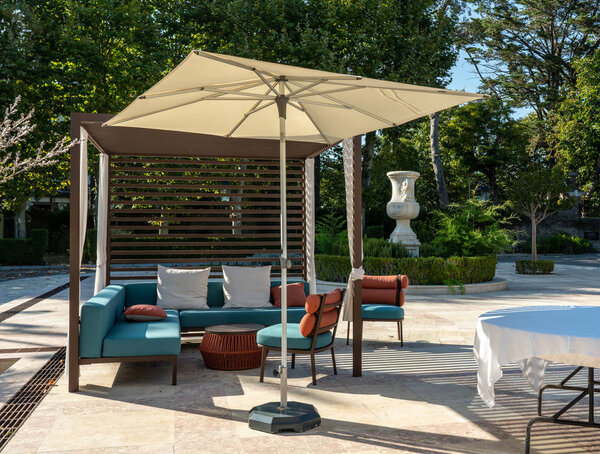 Outdoor lounging chairs and seats on patio in garden