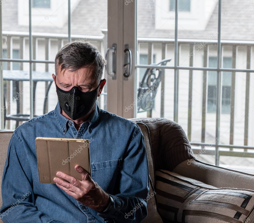 Worried senior caucasian man wearing protective mask against corona virus
