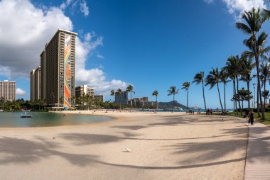 Broad sandy beach and pool by the Hilton Hawaiian Village on Oahu