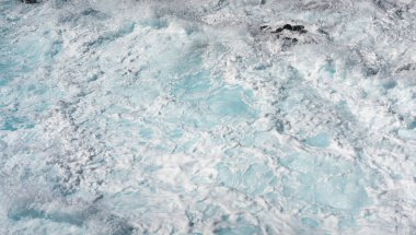 Winter waves crash on the rocky shoreline at Kaena Point on Oahu
