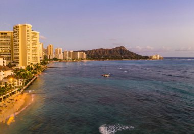 Aerial view of Waikiki beach towards Diamond Head at sunset