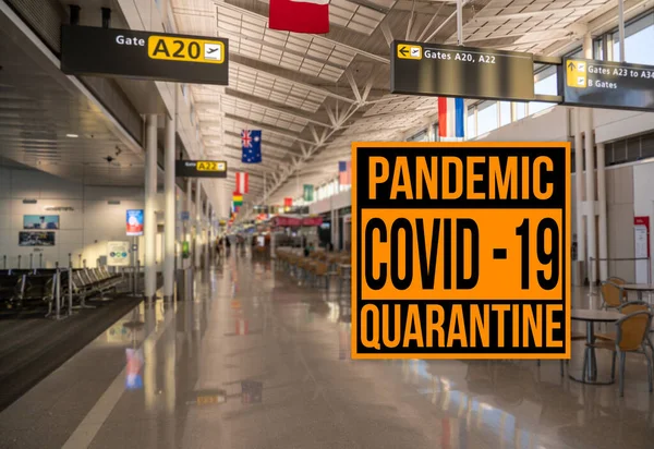 Pandemic sign warning of quarantine due to Covid-19 or corona virus against aiport background