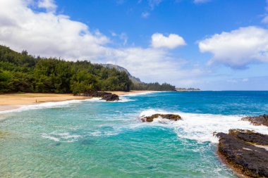 Aerial drone shot of Lumahai Beach on the north shore of Kauai in Hawaii