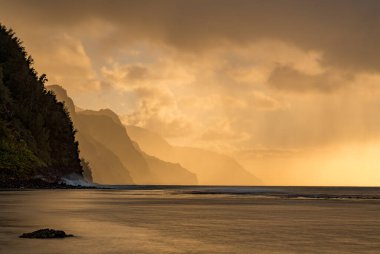 Sunset over the receding mountains of the Na Pali coast of Kauai in Hawaii