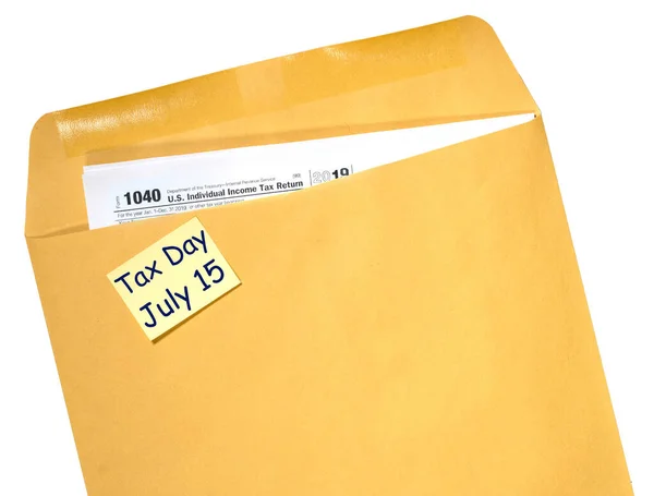 Tax Day reminder for July 15 due to Coronavirus delay on envelope — Stok fotoğraf