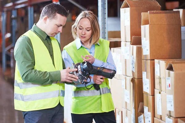 Warehouse Management System. Worker with barcode scanner — Stock Photo, Image