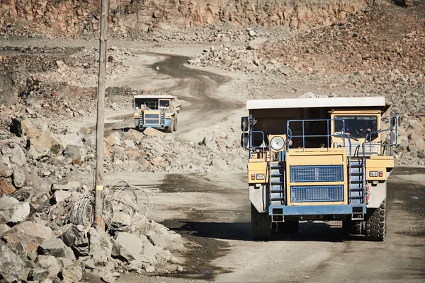 Huge dump truck transporting granite rock or iron ore — Stock Photo, Image