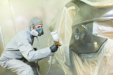 repairman painter in chamber painting automobile car bonnet clipart