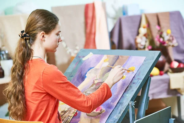 Girl painting still life by oil paint in studio — Stock Photo, Image