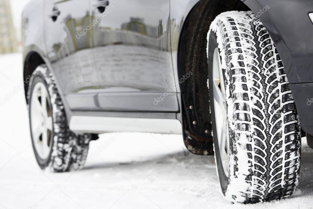 Winter tyres wheels installed on suv car outdoors