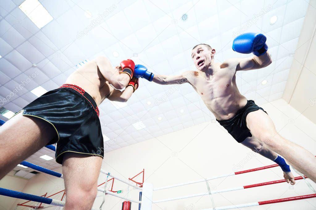Muay thai fighters at boxing ring