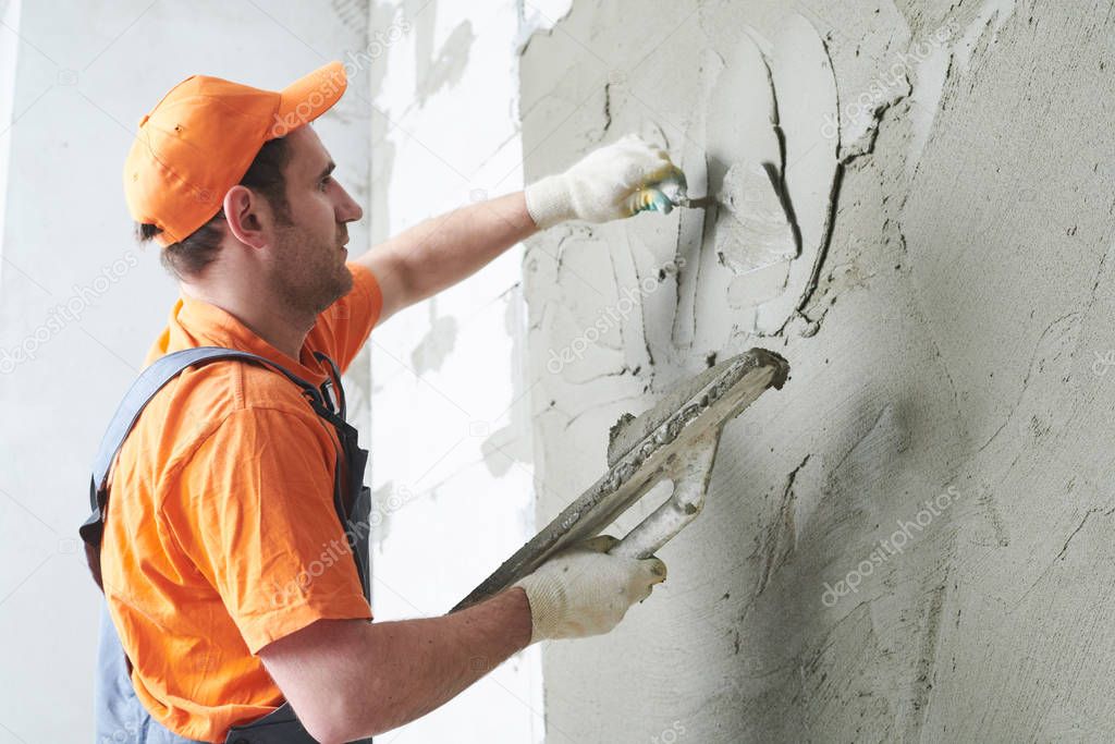 Plasterer putting plaster on wall. slow motion