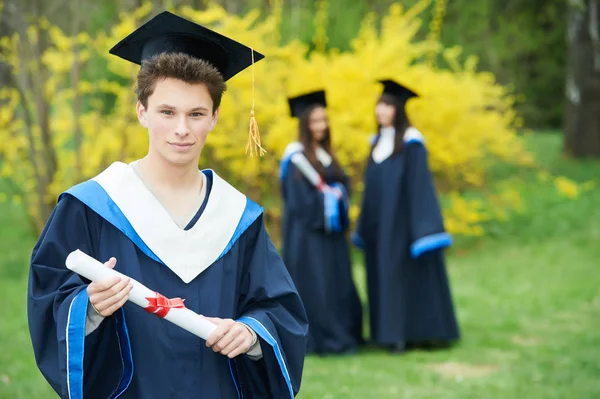 Education. happy graduation students with diploma — Stock Photo, Image