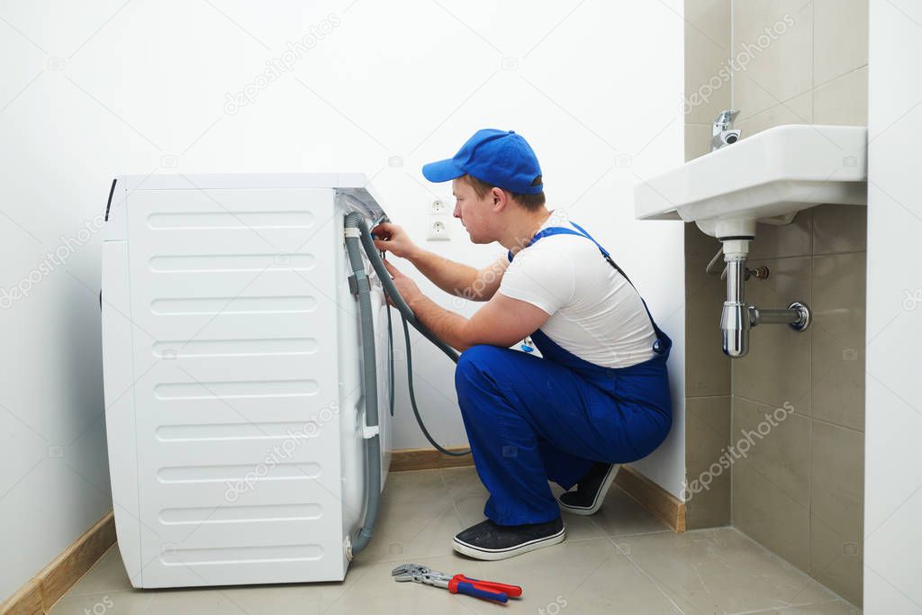 washing machine installation or repair. plumber connecting appliance