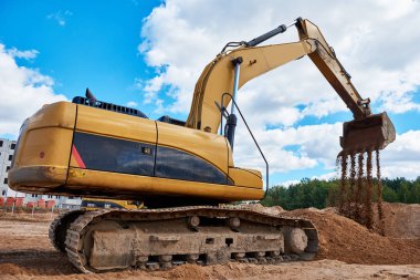 Ekskavatör yükleyici, harfiyat işleri