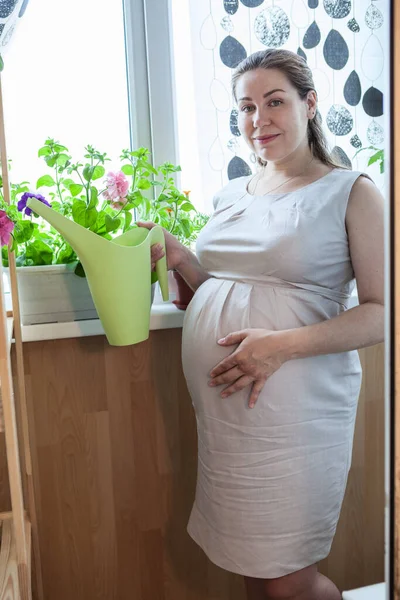 Portrait Pregnant Gardener Water Can Stands Domestic Balcony Potted Flowers — Stock Photo, Image