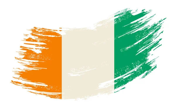 Ivorian flag grunge brush background. Vector illustration. — Stock vektor