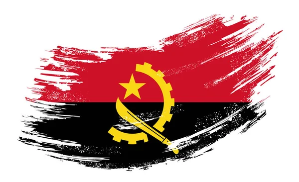 Angolan flag grunge brush background. Vector illustration. — Stockvector