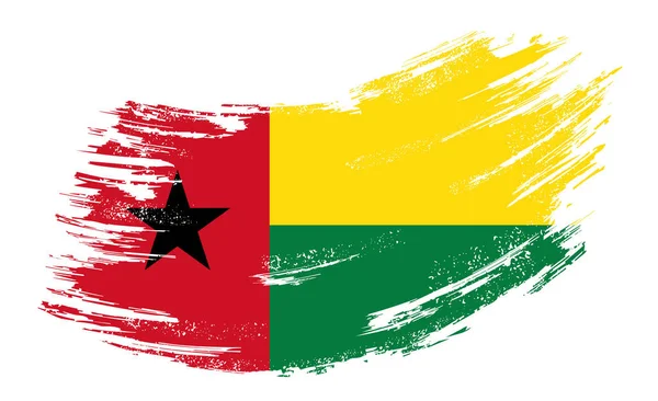 Guinea-Bissau flag grunge brush background. Vector illustration. — 图库矢量图片