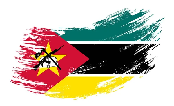 Mozambique flag grunge brush background. Vector illustration. — Stock Vector