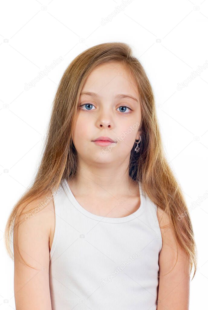 Young cute serious girl with grey blue eyes and long light brown hair isolated on white background