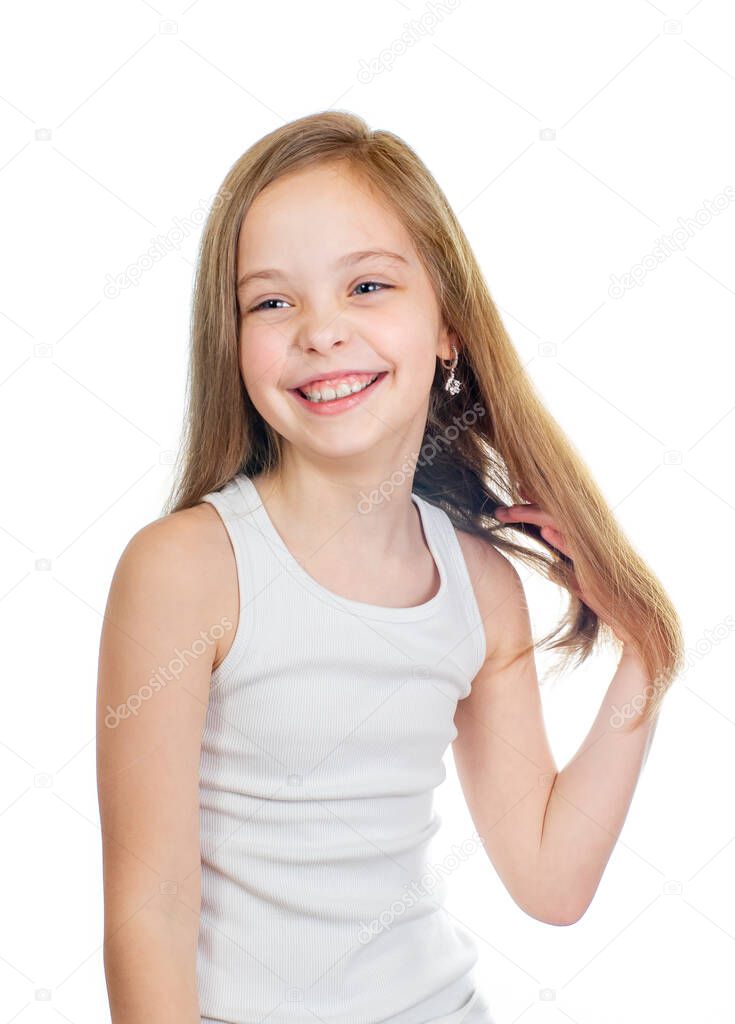 Young cute smiling girl with grey blue eyes and long light brown hair isolated on white background