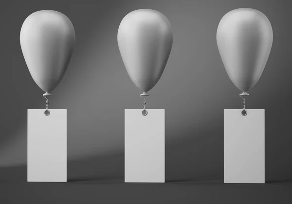 Three ballonos with blank banners on dark grey background — Stock Photo, Image