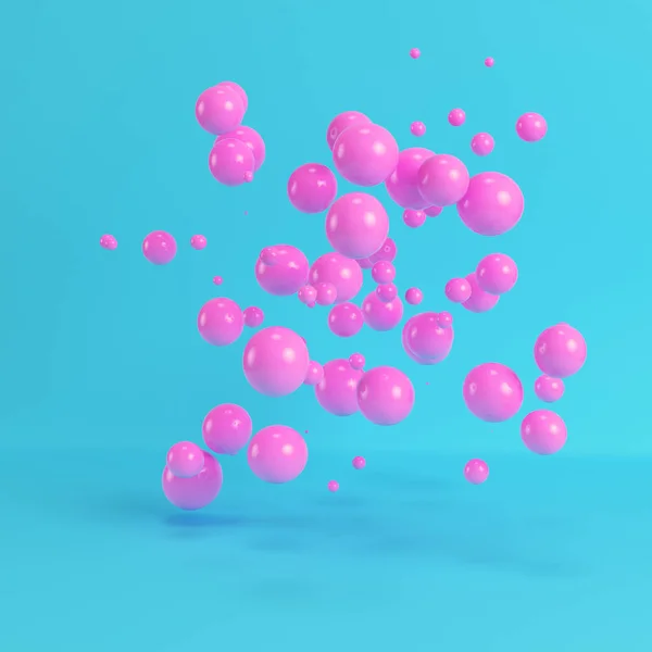 Roze bollen vliegen op heldere blauwe achtergrond in pastel kleuren — Stockfoto