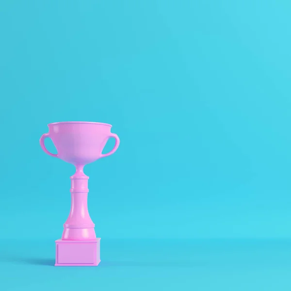 Pink trophy cup on bright blue background in pastel colors — Stock Photo, Image