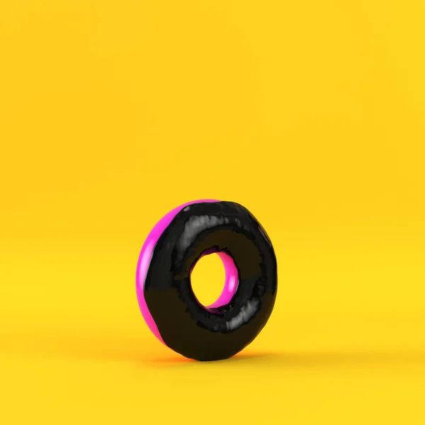 Donut con esmalte negro sobre fondo amarillo — Foto de Stock