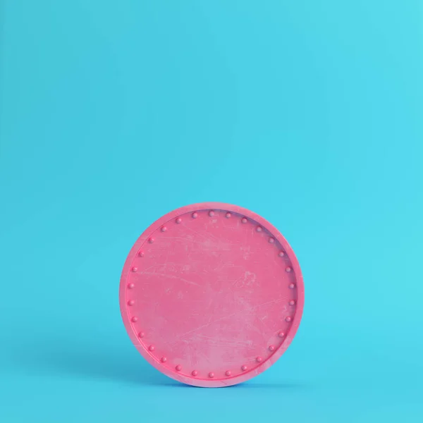 Pink blank scratched coin on bright blue background in pastel co — Stock Photo, Image