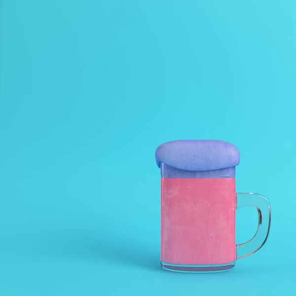 Mug of pink beer with blue foam on bright blue background in pas