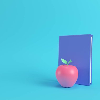 Pembe apple ve pastel renkler parlak mavi zemin üzerine kitap