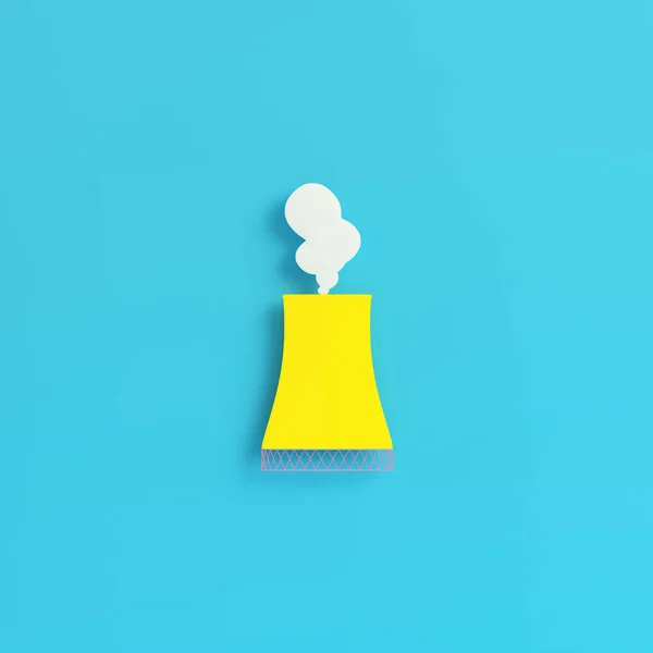 Yellow smoking pipe of nuclear power plant on bright blue backgr — 스톡 사진