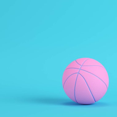 Pembe basketbol topu parlak mavi arka planda pastel renklerde.