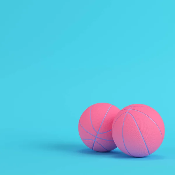 Pink basketball balls on bright blue background in pastel colors — ストック写真