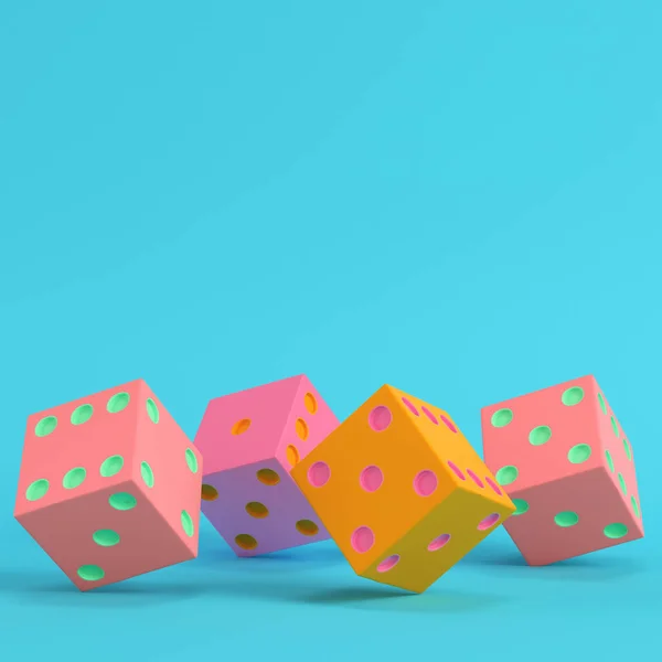 Four colorful dices on bright blue background in pastel colors. — Stock Photo, Image